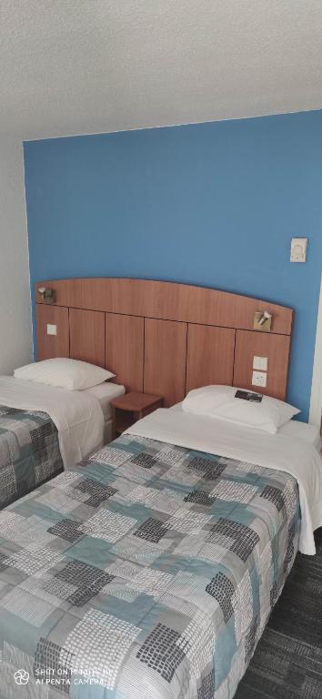Postel nebo postele na pokoji v ubytování Kyriad Mulhouse Est - Lutterbach