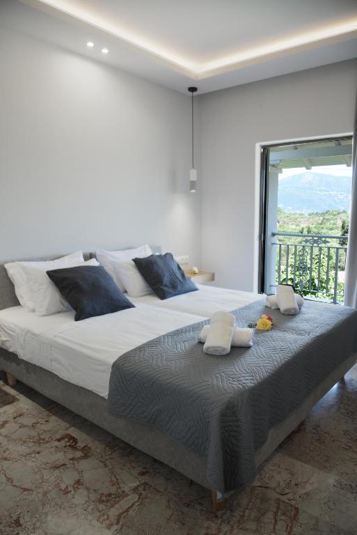 Postel nebo postele na pokoji v ubytování Spyridoula Resort in Corfu