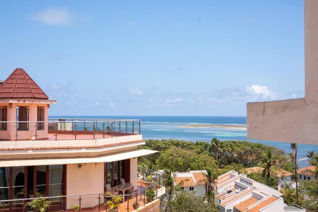 a view of the ocean from a building at Luxury 3BR Nyali Beachfront Apartment - 3 Min Walk in Mombasa