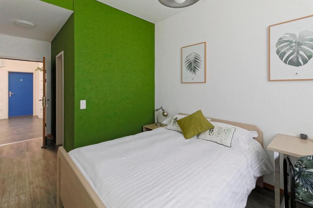 Postel nebo postele na pokoji v ubytování Les Chambres du CTN
