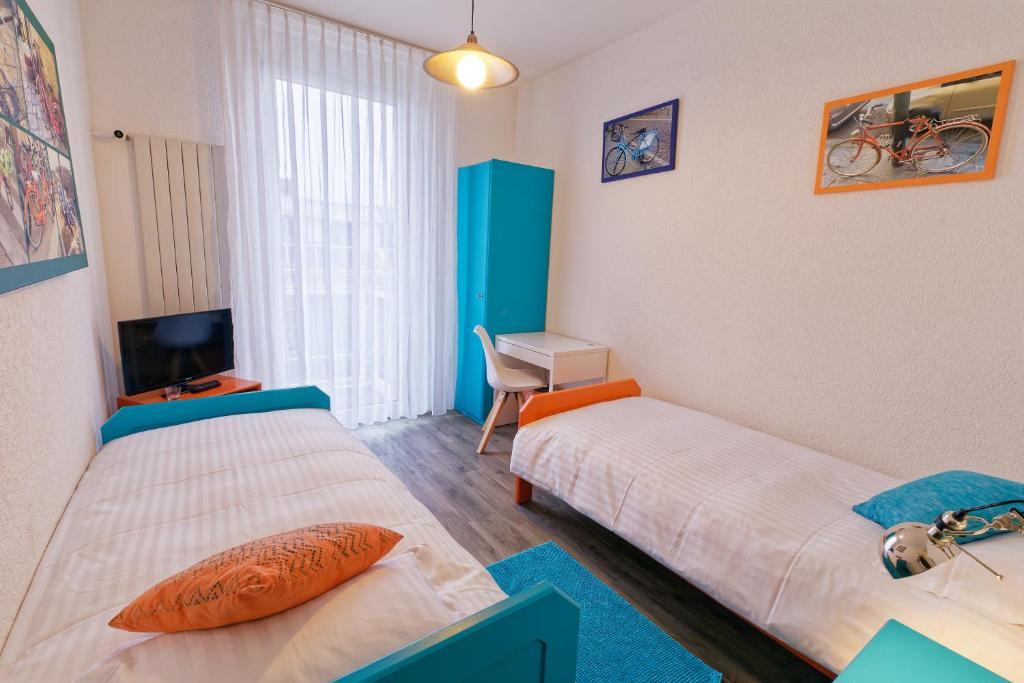 Postel nebo postele na pokoji v ubytování Les Chambres du CTN