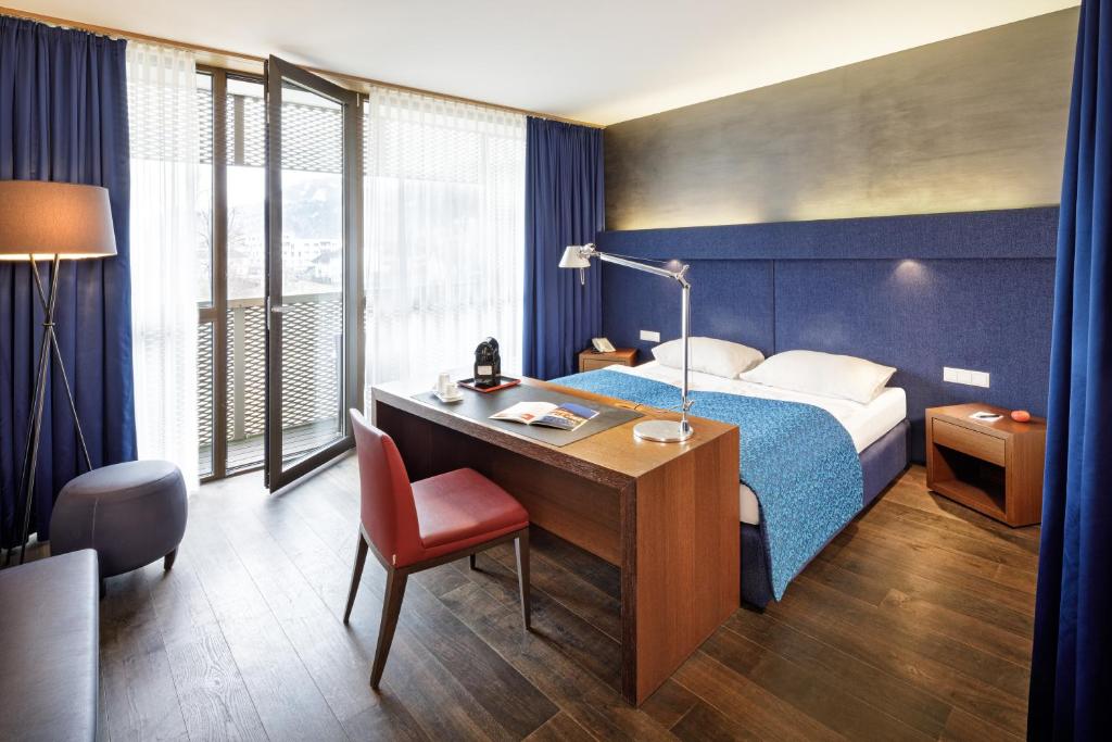 Voodi või voodid majutusasutuse Asia Hotel & Spa Leoben toas