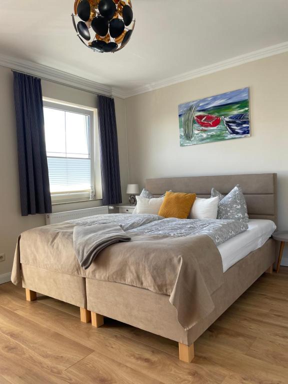Ένα ή περισσότερα κρεβάτια σε δωμάτιο στο Ostseestrand-Apartments