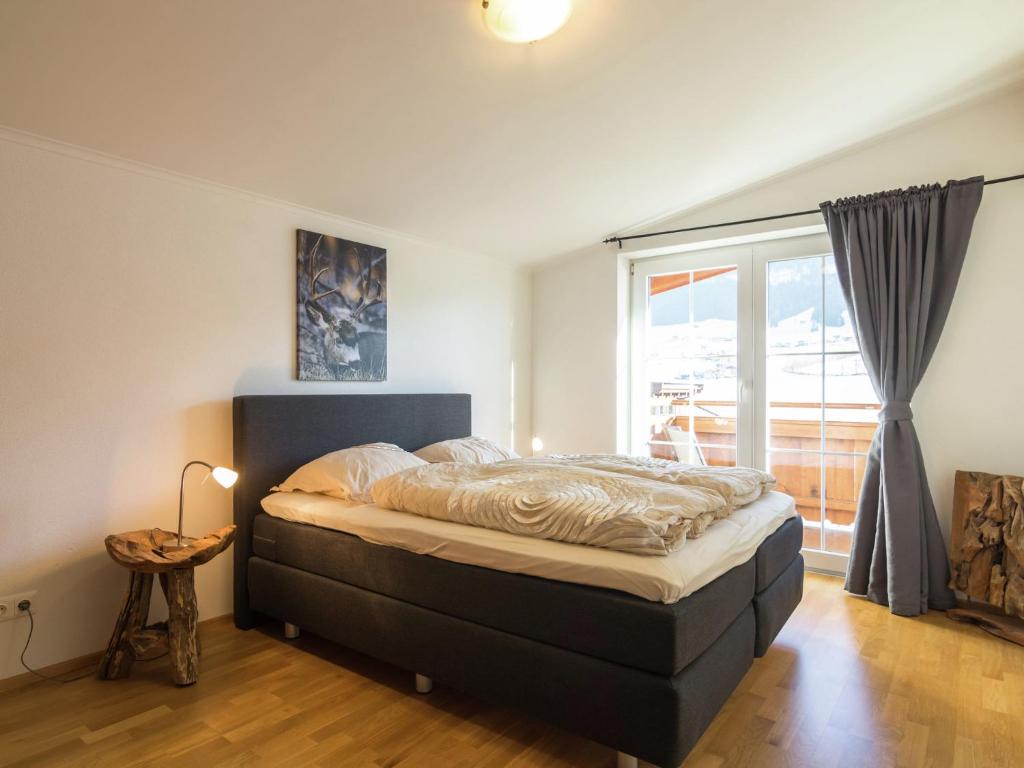 A bed or beds in a room at Luxurious holiday home with terrace in Tyrol