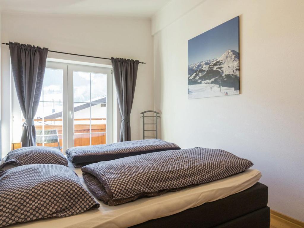 A bed or beds in a room at Luxurious holiday home with terrace in Tyrol