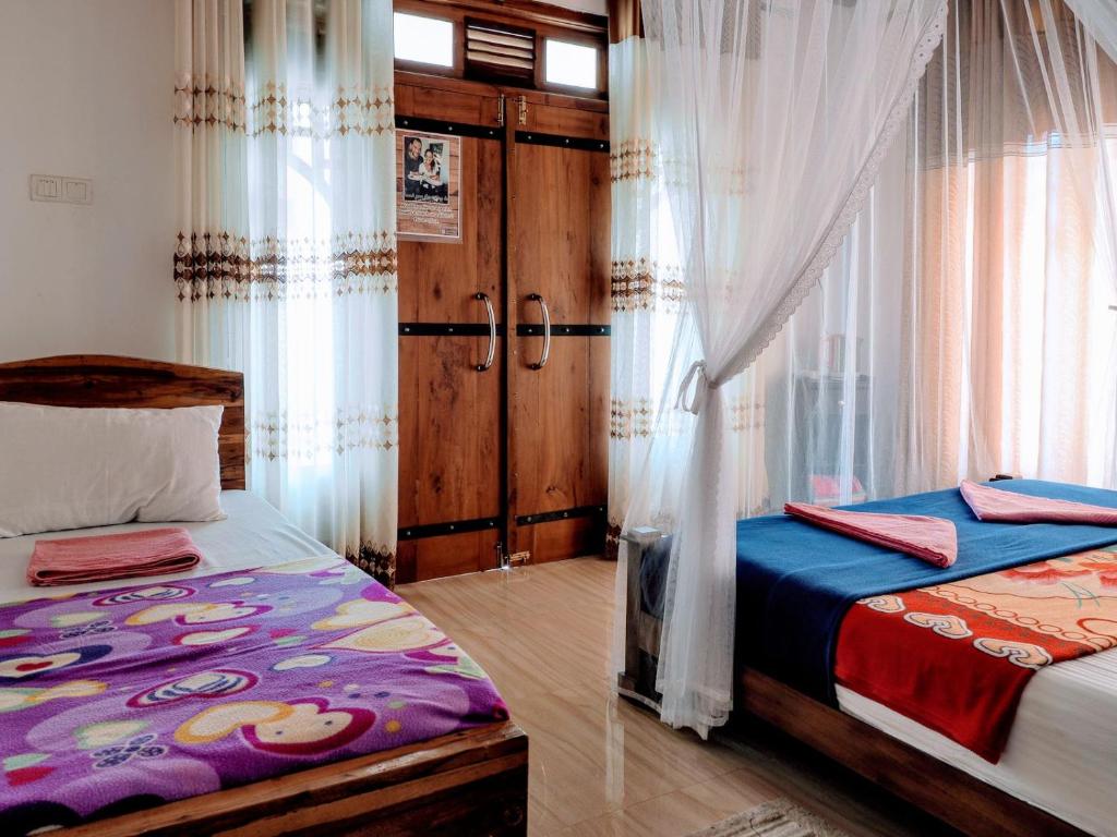Postel nebo postele na pokoji v ubytování Ella Mount Villa