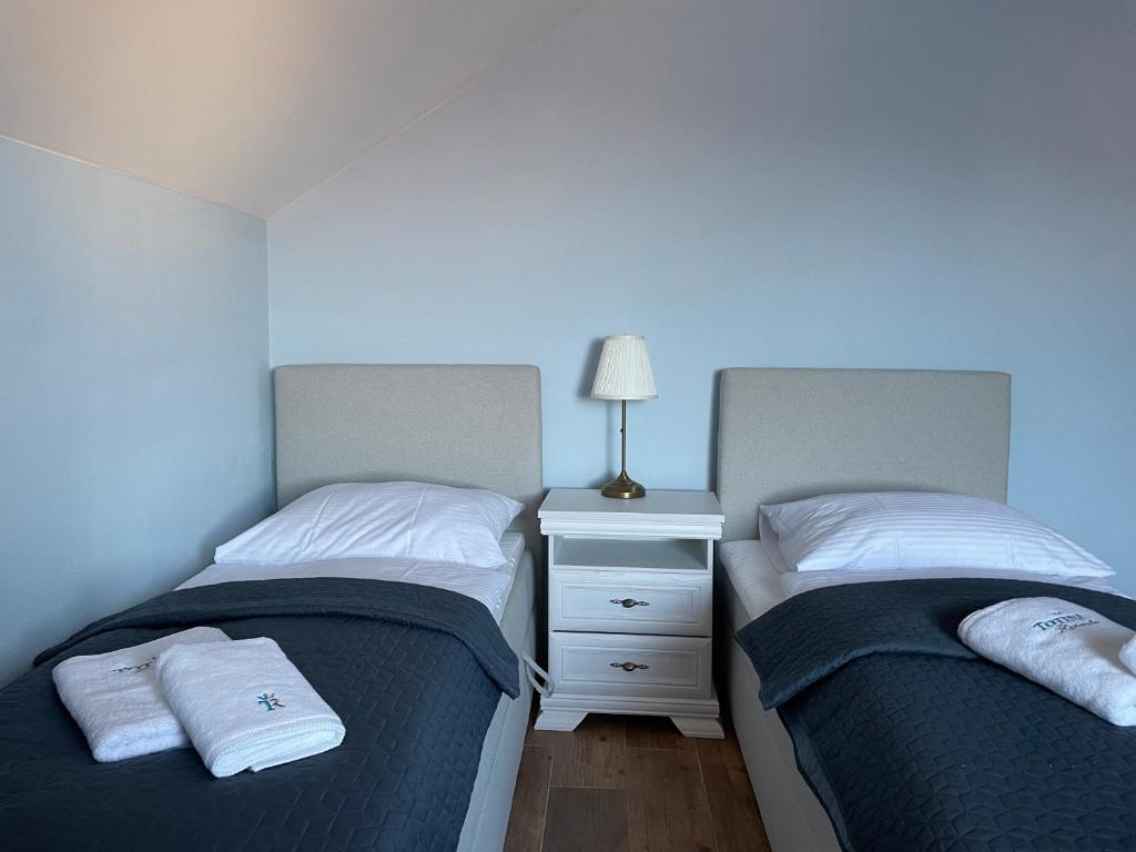 Postel nebo postele na pokoji v ubytování Totina Apartments