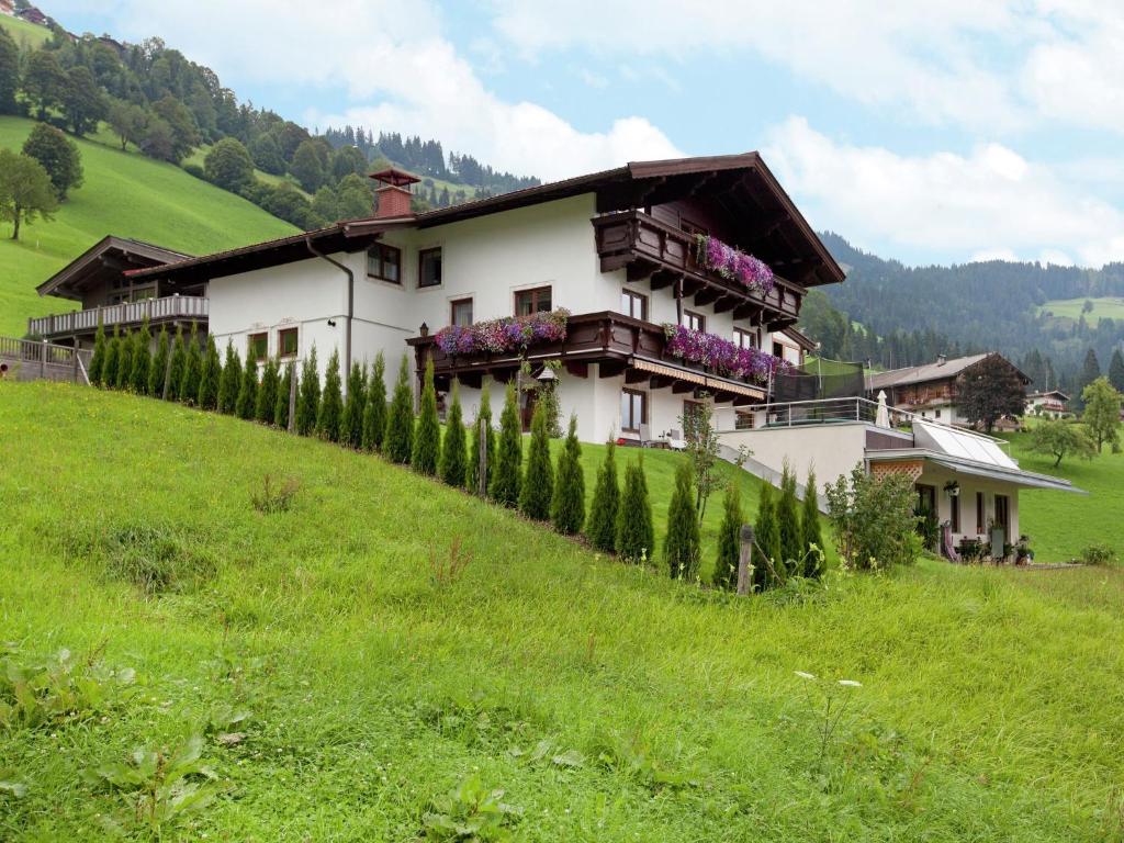 a house on the side of a hill at Beautiful apartment in Brixen in the Thale in Brixen im Thale