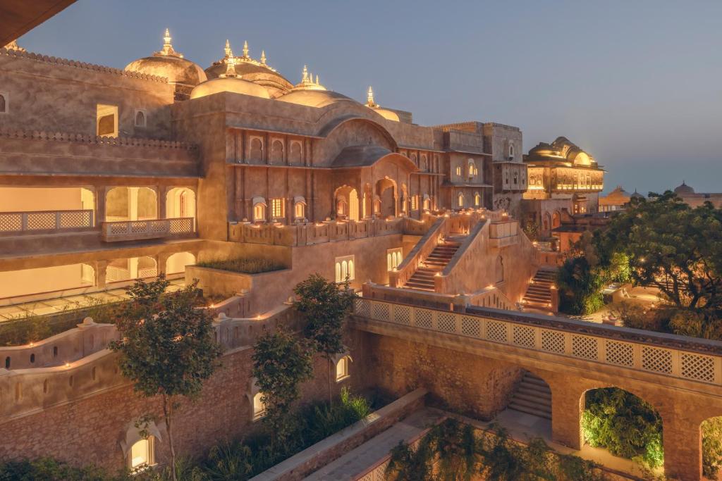 a building with domes on the side of it at Six Senses Fort Barwara Sawai Madhopur in Sawāi Mādhopur