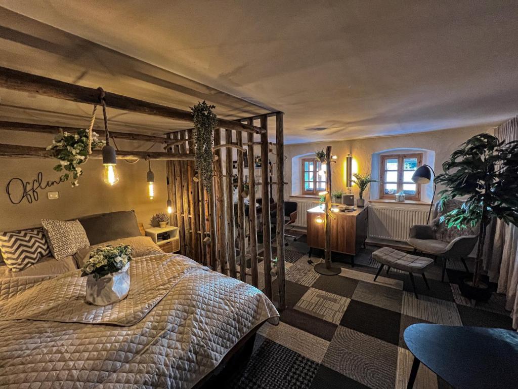 a bedroom with a large bed in a room at Der alte Torturm in Berg bei Rohrbach