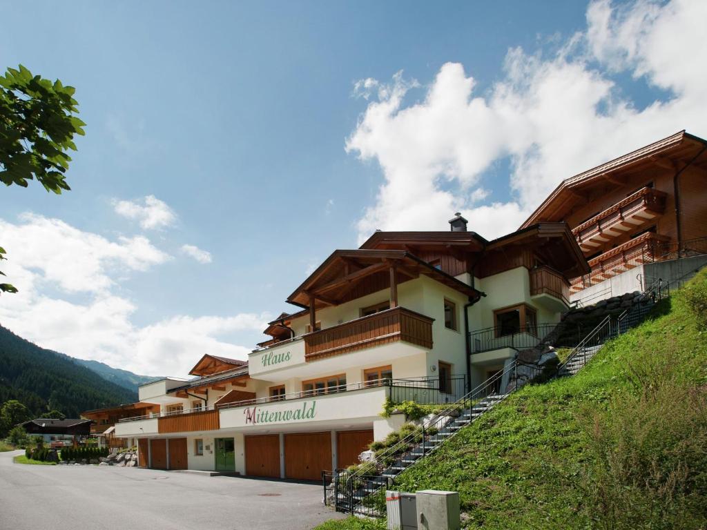 a building on the side of a hill at Chalet apartment in ski area Saalbach-Hinterglemm in Saalbach Hinterglemm