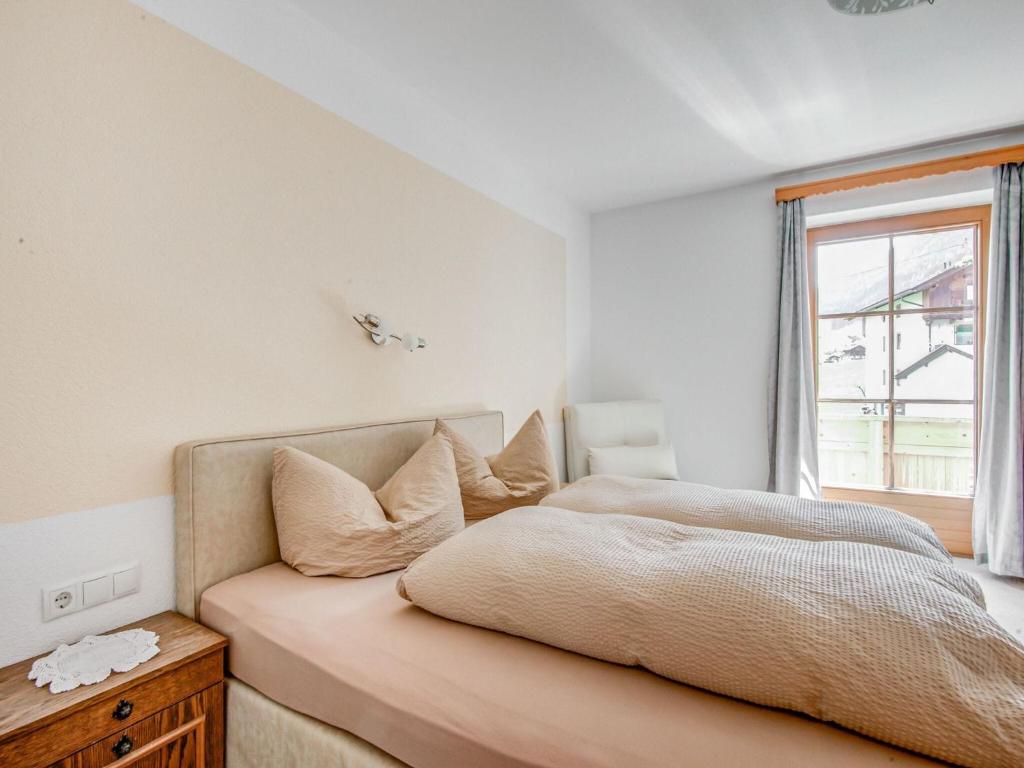 Postel nebo postele na pokoji v ubytování Attractive apartment in Hainzenberg with ski room
