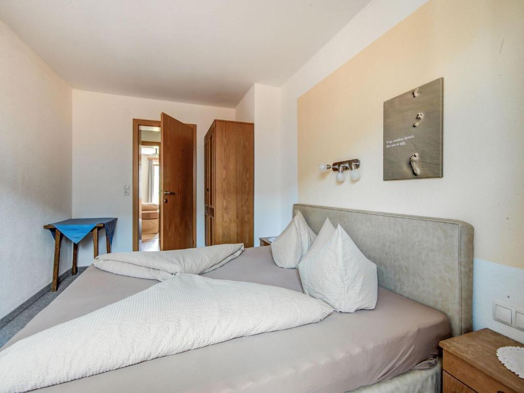 Postel nebo postele na pokoji v ubytování Attractive apartment in Hainzenberg with ski room