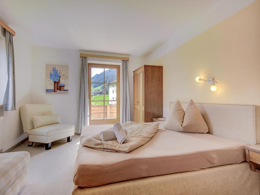 Postel nebo postele na pokoji v ubytování Attractive apartment in Hainzenberg with ski room