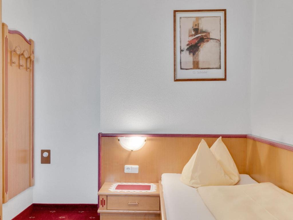 Postel nebo postele na pokoji v ubytování Apartment in Hainzenberg near Ski Lift