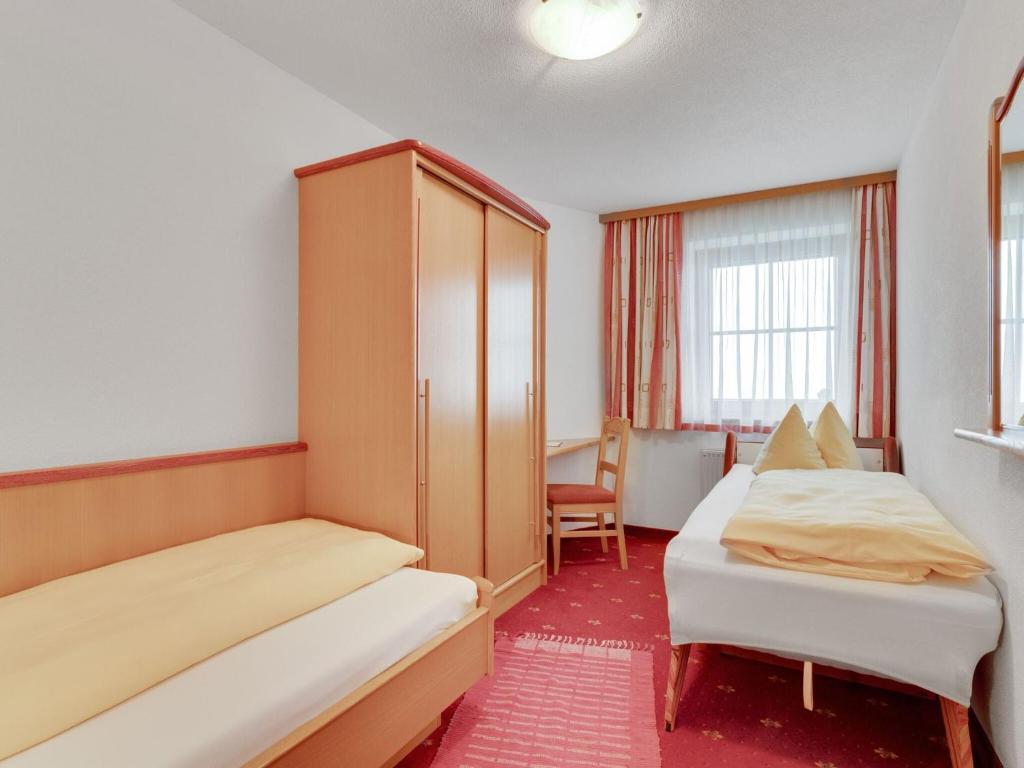 Postel nebo postele na pokoji v ubytování Apartment in Hainzenberg near Ski Lift