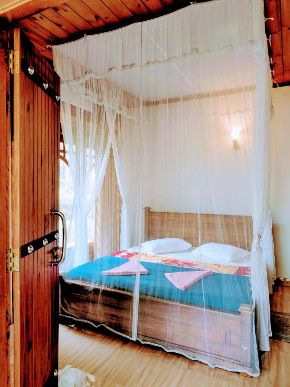 Postel nebo postele na pokoji v ubytování Ella Mount Villa