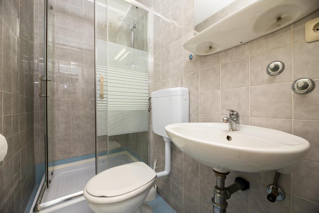 Koupelna v ubytování Meliores Rooms