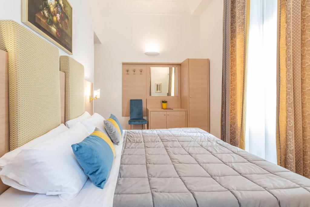 Postel nebo postele na pokoji v ubytování Hotel Medici