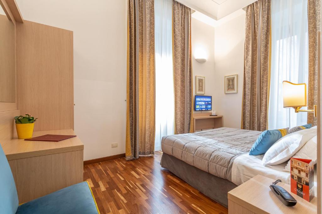 Postel nebo postele na pokoji v ubytování Hotel Medici