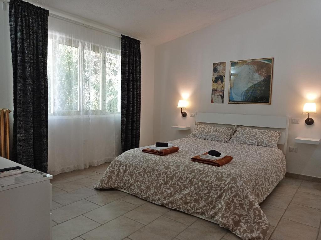 Łóżko lub łóżka w pokoju w obiekcie Gli Archi Country Home