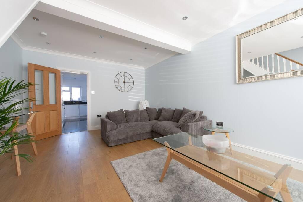 a living room with a couch and a glass table at Trendy 2 Bed - A hidden Luxury in Hayes nr Heathrow in Hayes