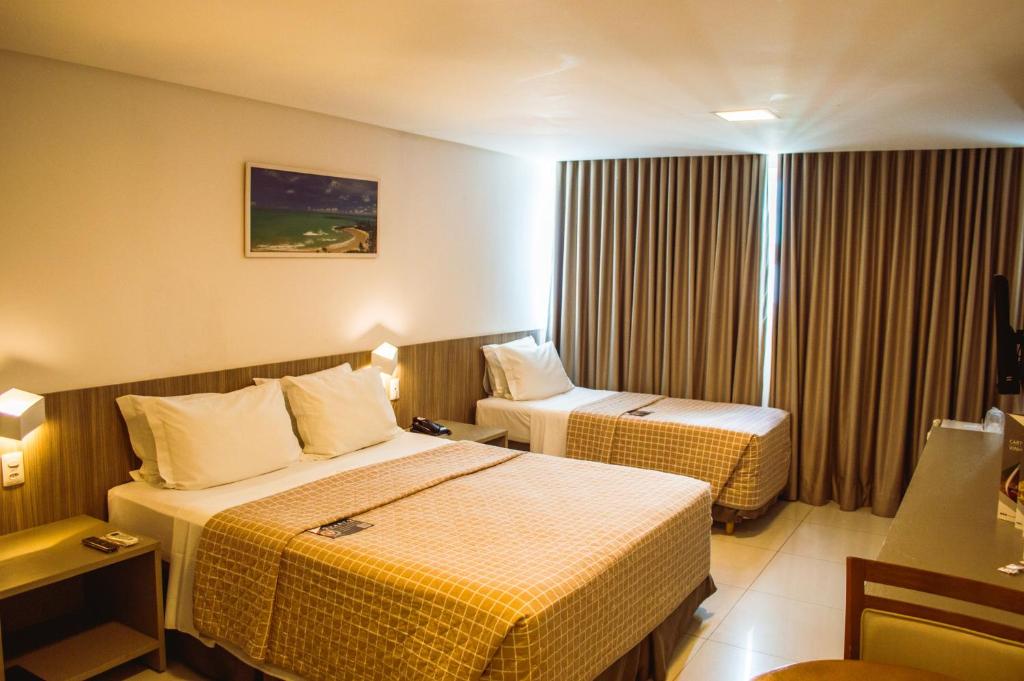 Cama ou camas em um quarto em Nord Luxxor Cabo Branco