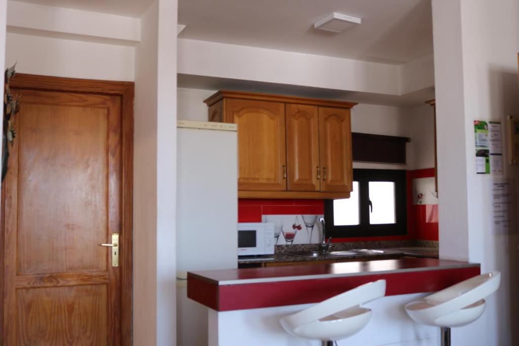 Kuchyň nebo kuchyňský kout v ubytování Apartamentos La Carmen