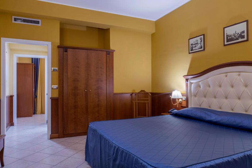 Posteľ alebo postele v izbe v ubytovaní Hotel San Michele