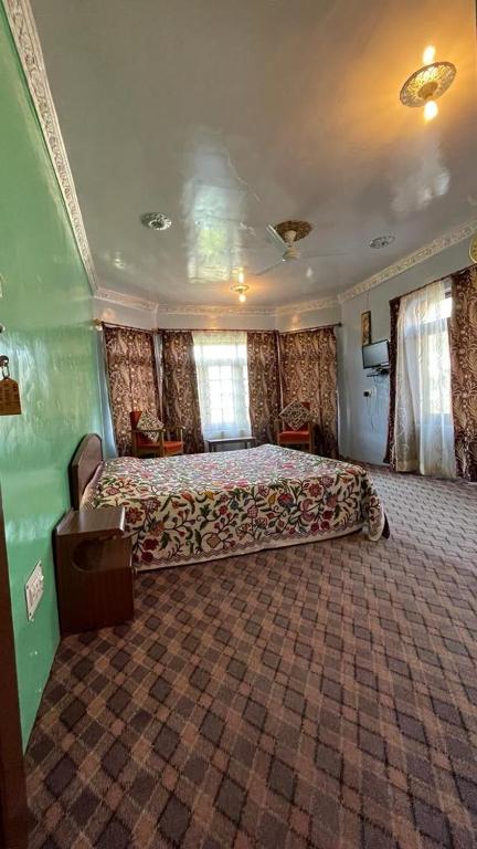 Postel nebo postele na pokoji v ubytování Dilaram Guest House
