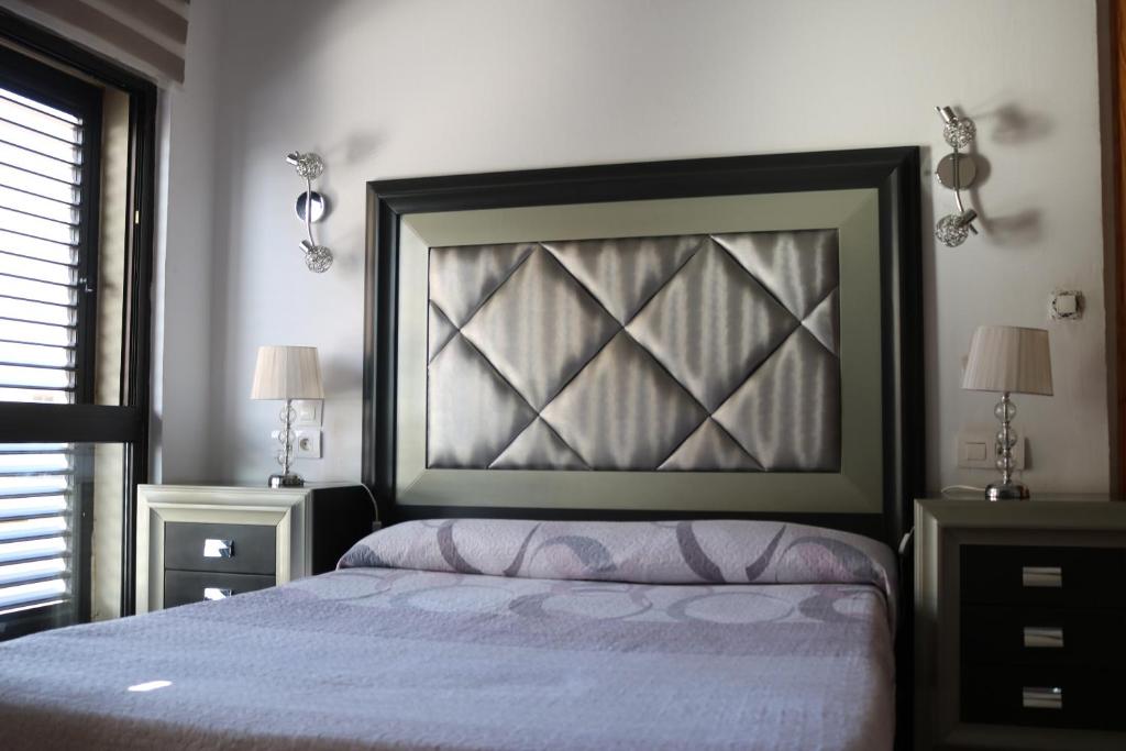 Postel nebo postele na pokoji v ubytování Apartamentos La Carmen