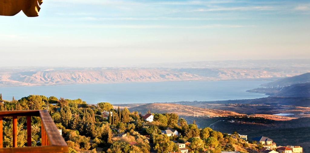 a view of a lake from the top of a mountain at Honny - Boutique Hotel in Amirim