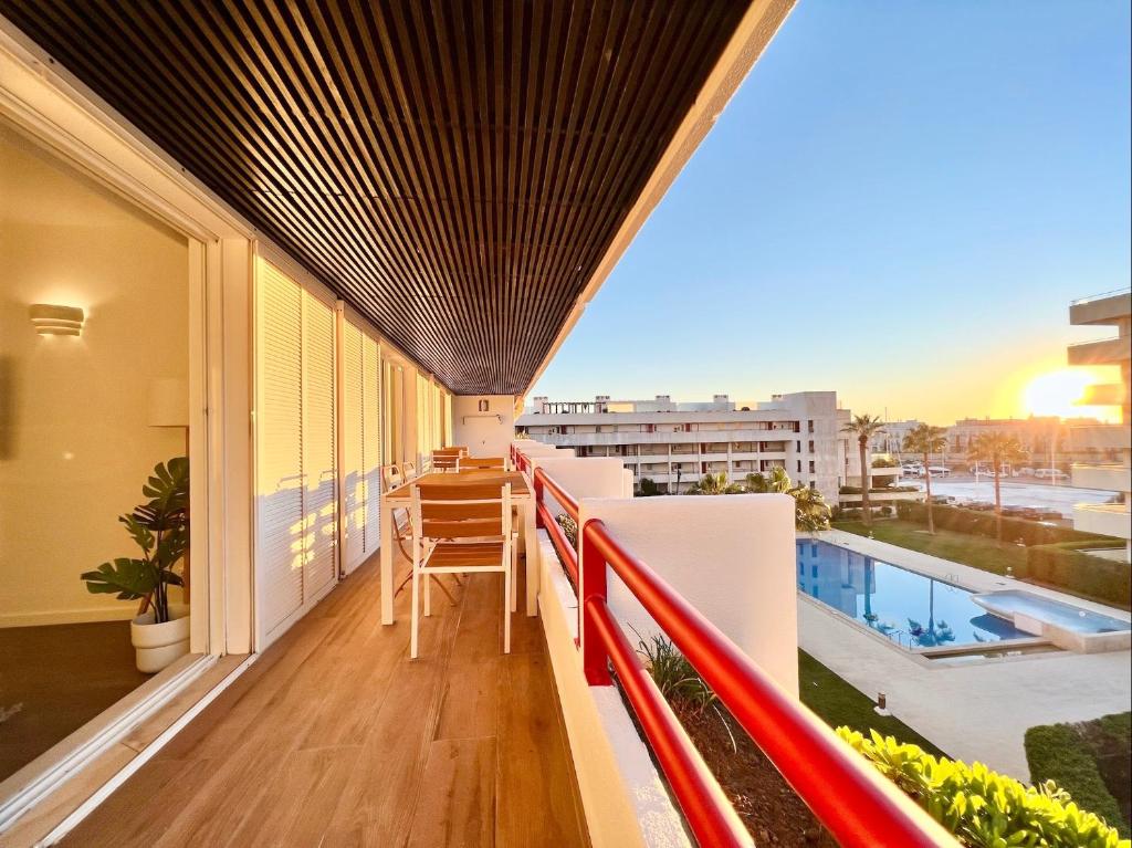 an apartment balcony with a view of a pool at Home Out Vilamoura 20 Levante in Vilamoura