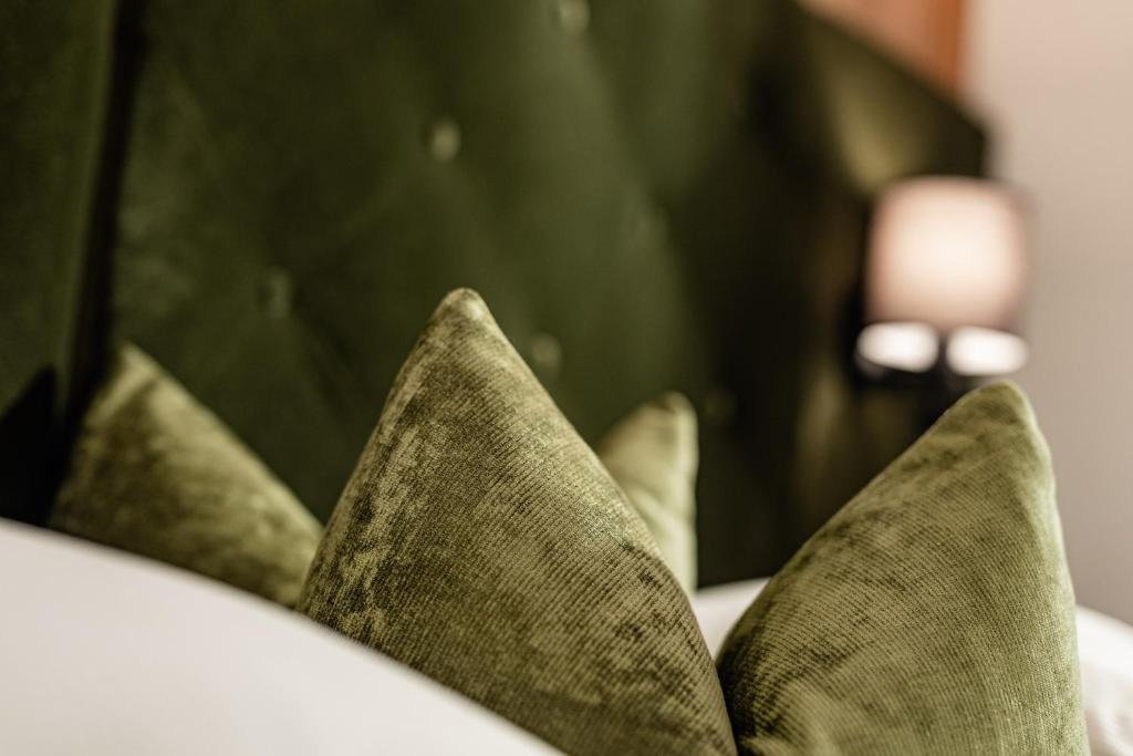 Postel nebo postele na pokoji v ubytování Boutique & Fashion Hotel Maciaconi - Gardenahotels