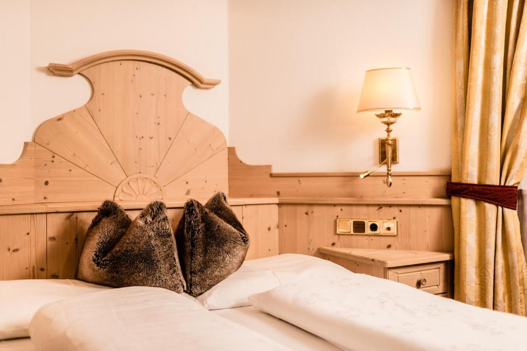 Postel nebo postele na pokoji v ubytování Romantik & Family Hotel Gardenia***S