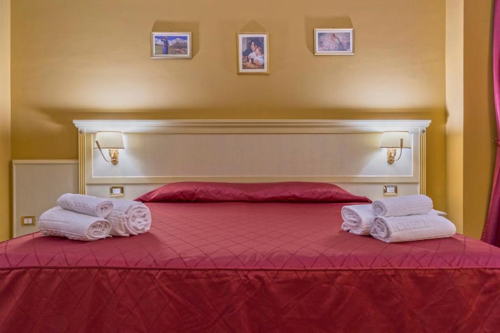 Posteľ alebo postele v izbe v ubytovaní Hotel San Michele