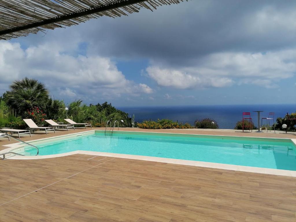 a swimming pool with a view of the ocean at Oroverde in Bergeggi