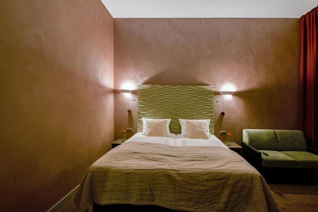 Postel nebo postele na pokoji v ubytování Artim Hotel