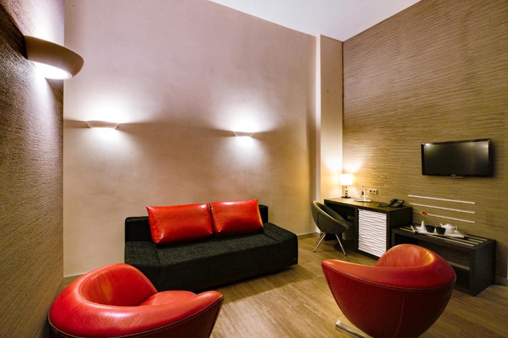 TV a/nebo společenská místnost v ubytování Artim Hotel