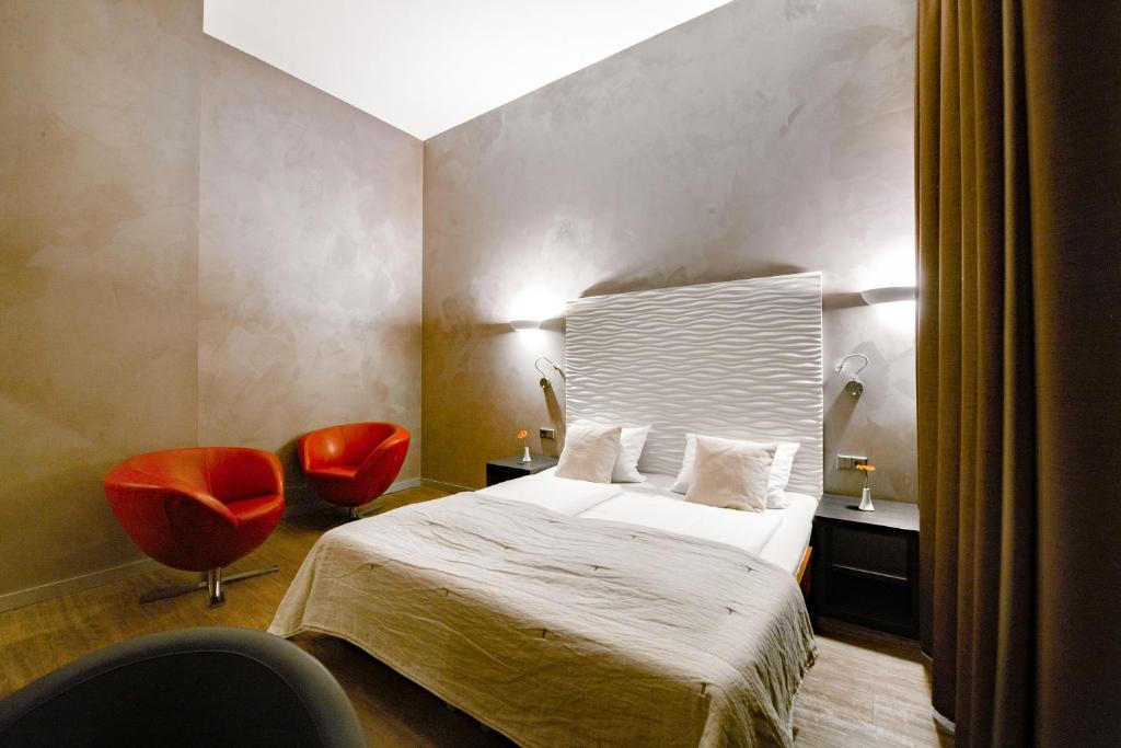 Postel nebo postele na pokoji v ubytování Artim Hotel