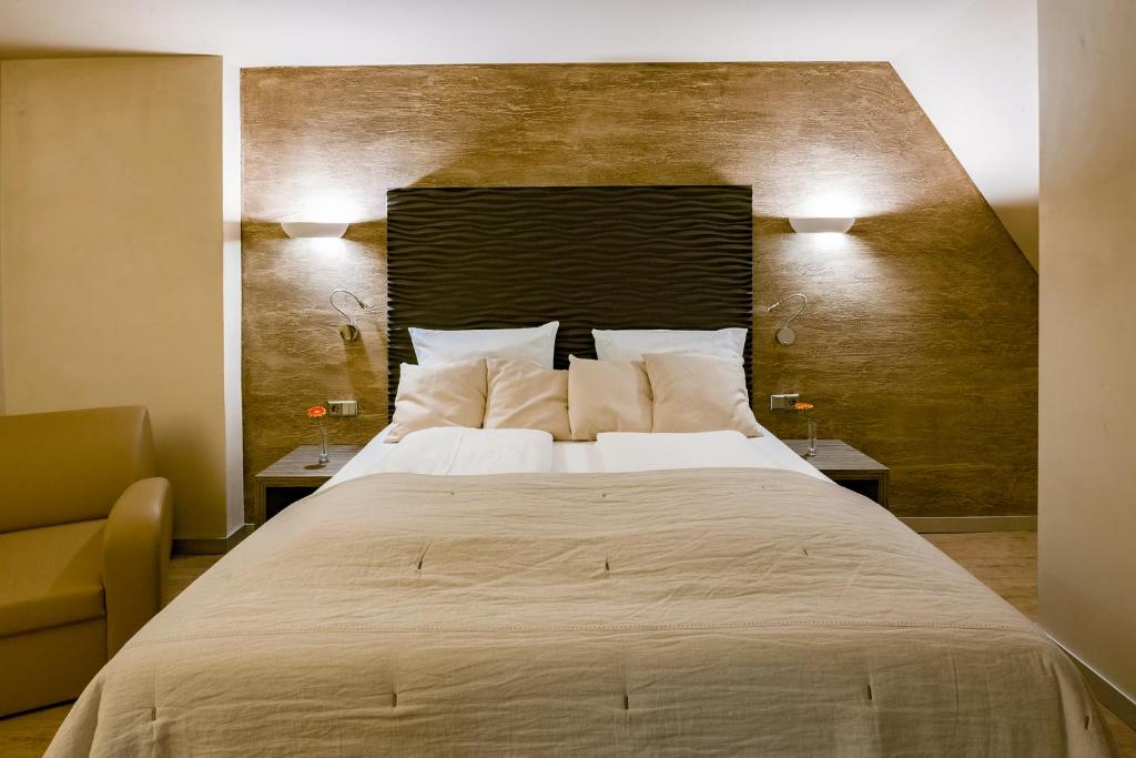 Postel nebo postele na pokoji v ubytování Artim Hotel
