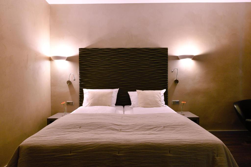 Postel nebo postele na pokoji v ubytování Artim Hotel