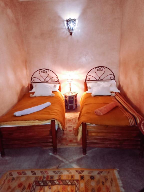 Postel nebo postele na pokoji v ubytování Riad Essaoussan