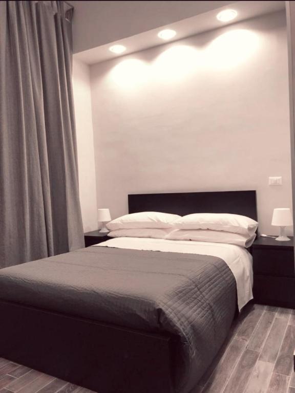 Postel nebo postele na pokoji v ubytování Caio Duilio B&B
