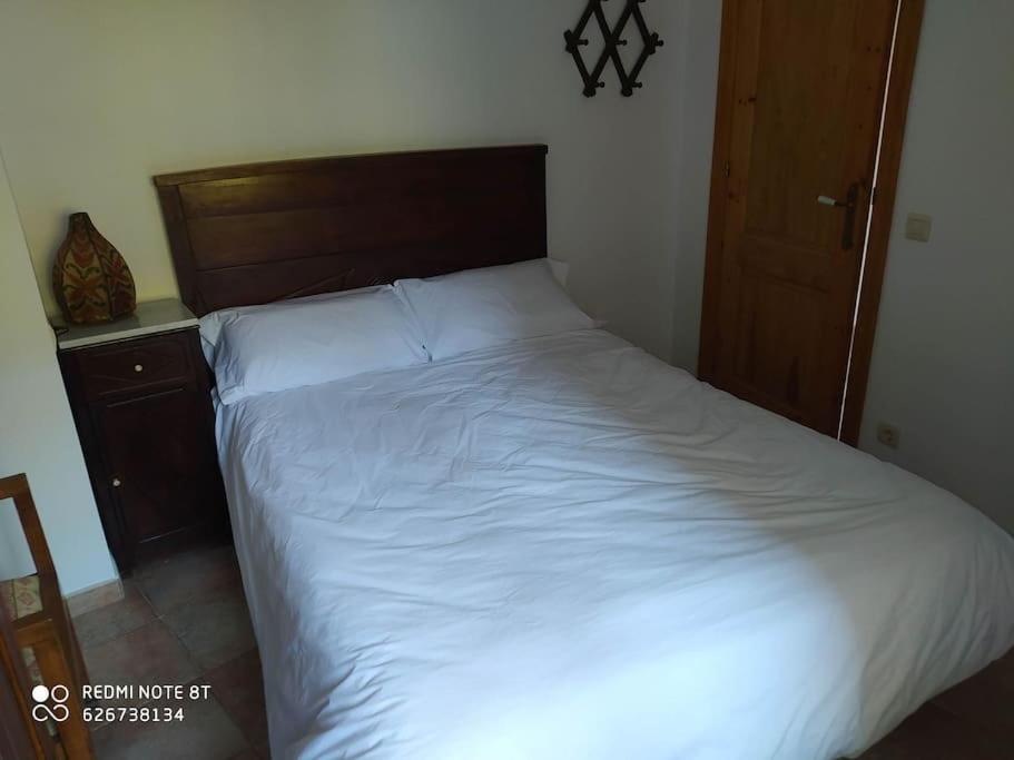 A bed or beds in a room at casa sobre rio Noguera Pallaresa