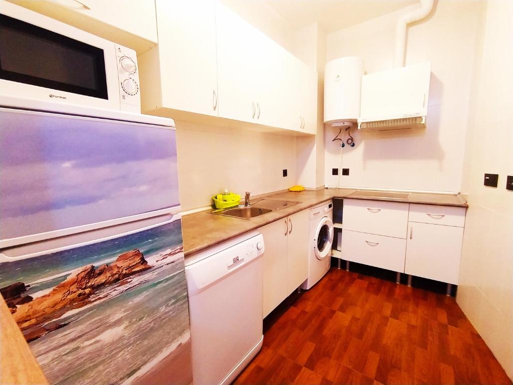 Kuchyň nebo kuchyňský kout v ubytování Delux Center Punta Umbría