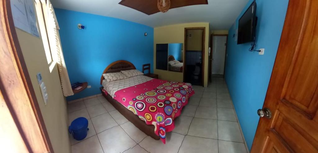 Postel nebo postele na pokoji v ubytování Hostal Aventura