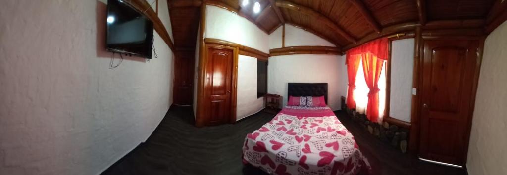 Postel nebo postele na pokoji v ubytování Hostal Aventura