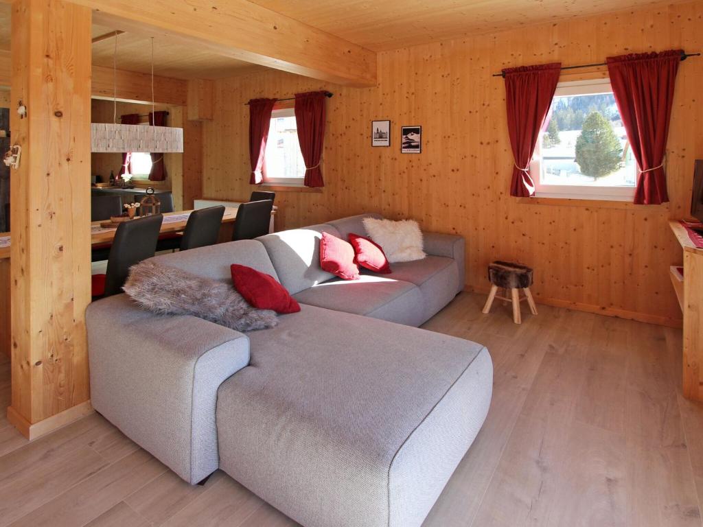 a living room with a couch and a table at Chalet in Hohentauern Styria near ski area in Hohentauern