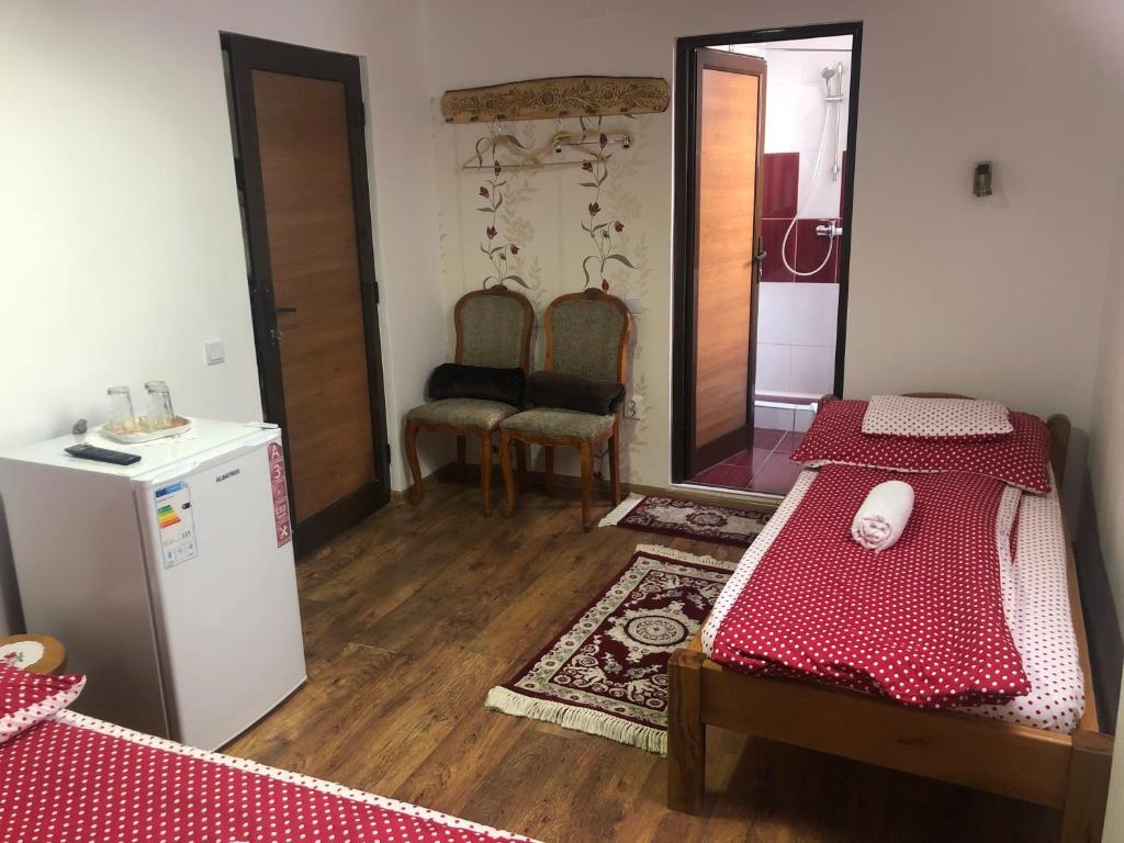 Postel nebo postele na pokoji v ubytování Tünde Vendégház